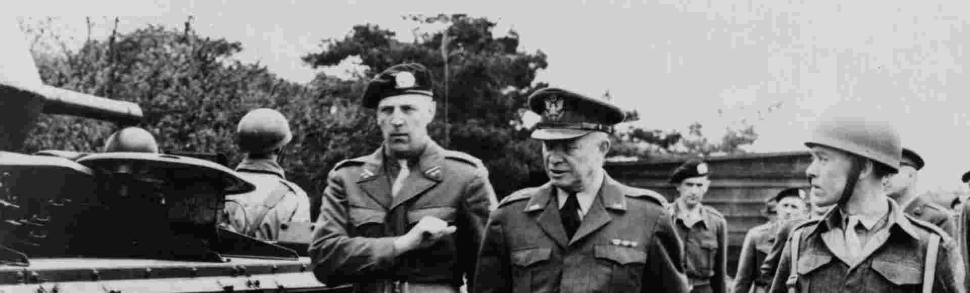 US General Dwight Eisenhower (1890-1969) inspecting troops.