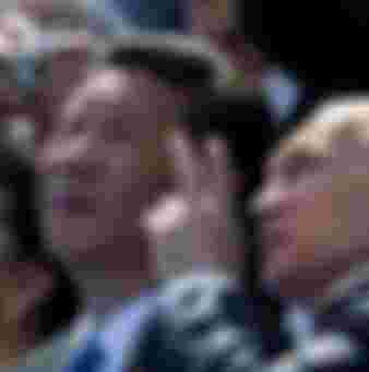 Russian President Vladimir Putin speaks to Chinese President Xi Jinping at the Victory Parade marking the 70th anniversary of the surrender of Nazi Germany in the Second World War.