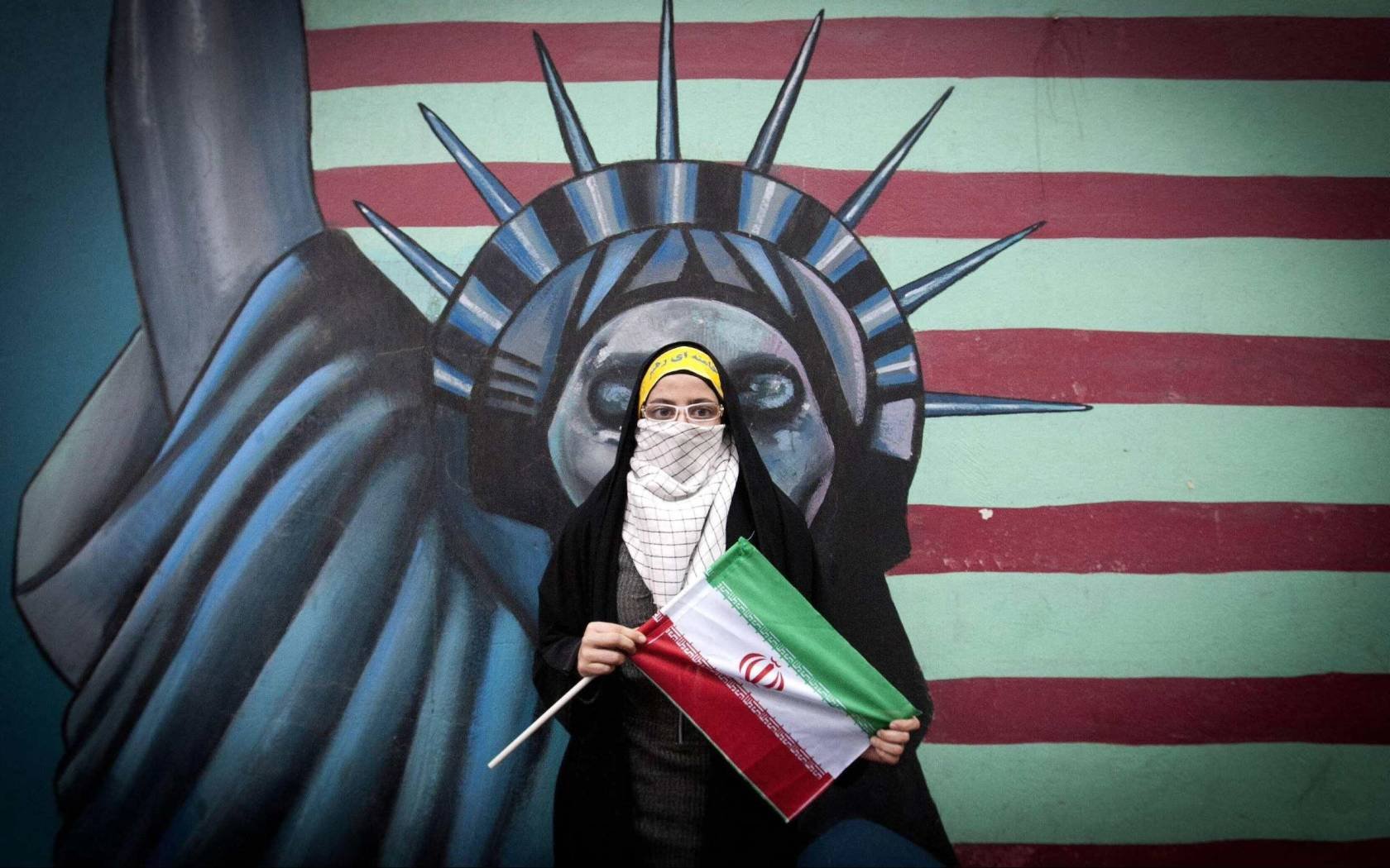 A student holds an Iran flag during a rally marking the 32nd anniversary of the 1979 seizure of the US Embassy in downtown Tehran, Iran, 4 November, 2011.