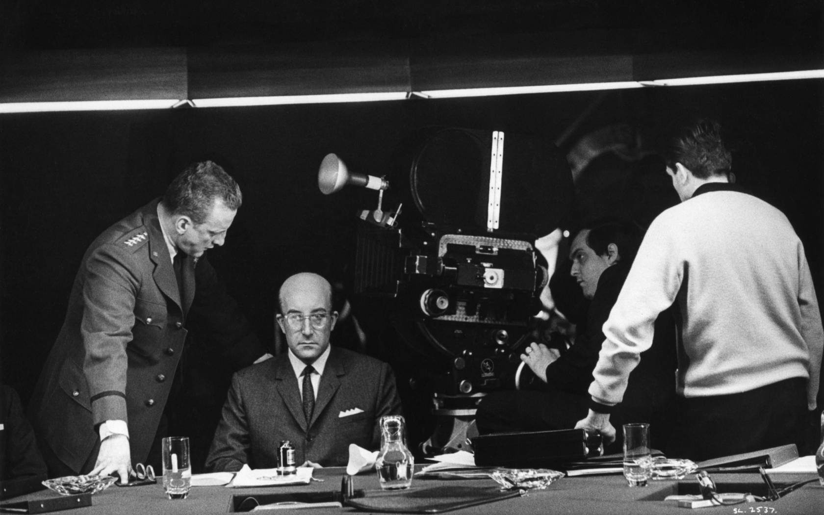 George C. Scott as General 'Buck' Turgidson Peter Sellers as President Merkin Muffley and director Stanley Kubrick in Dr Strangelove.