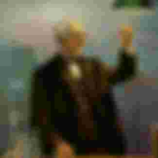 The great American inventor Thomas Edison is surrounded by his creations