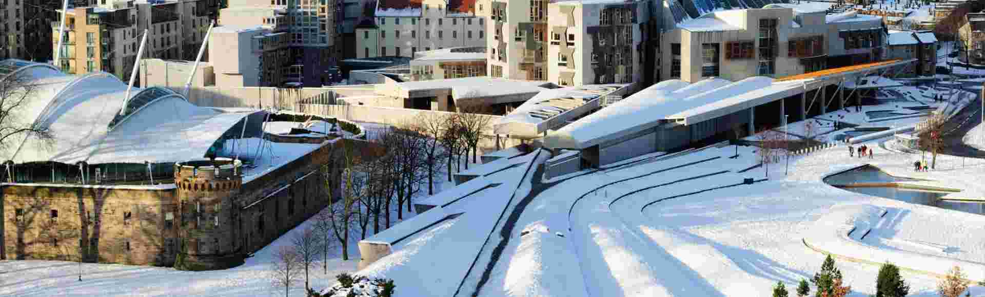 The Scottish Parliament building in the snow from Salisbury Crags, Edinburgh.