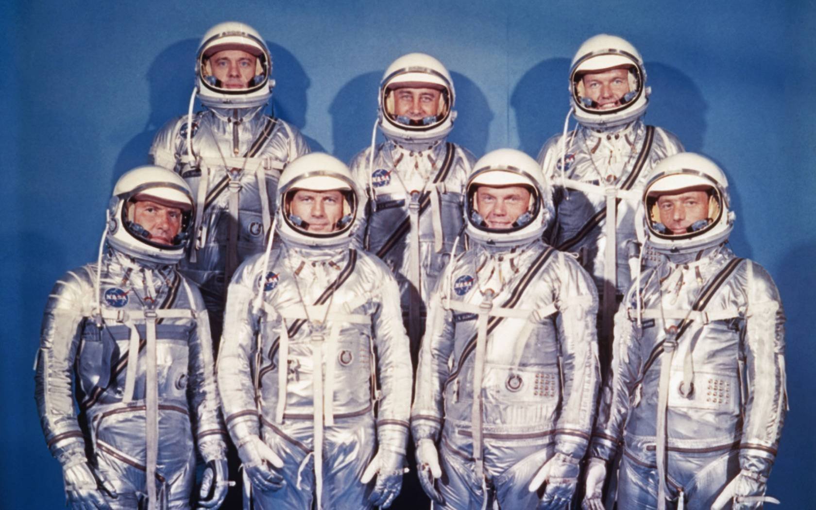 The original seven Project Mercury astronauts: front row, left to right, are Walter M. Schirra, Jr., Donald "Deke" K. Slayton, John Glenn Jr., and M. Scott Carpenter. Back row, left to right, are Alan Shepard Jr., Virgil I. "Gus" Grissom, and Gordon Copper.