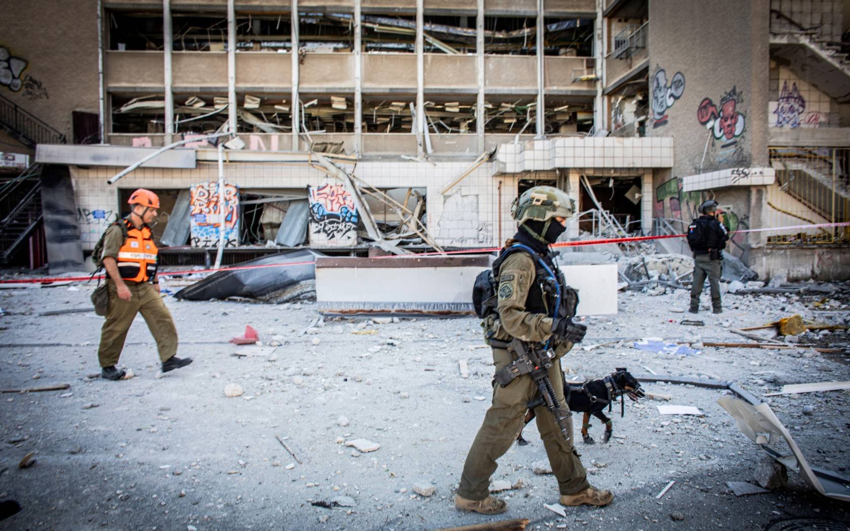 Israeli first responders at a site of an Iranian ballistic missile strike in Haifa.