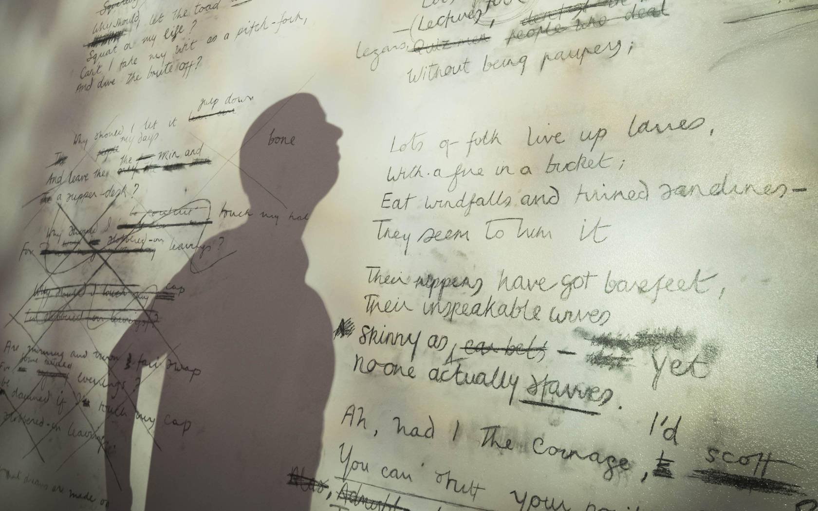A projection of the original manuscript of the poem 'Toads' by Philip Larkin.