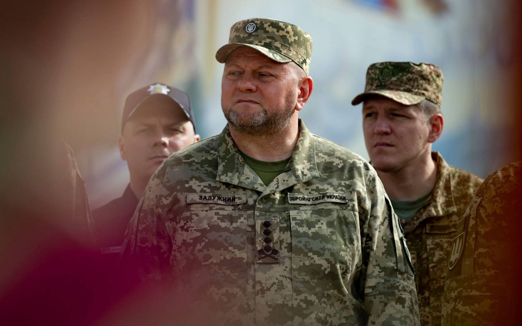 Valerii Zaluzhnyi listens to Volodymyr Zelenskyy during a ceremony marking the Day of Ukrainian Statehood on Mykhailivska Square, July 28, 2023.