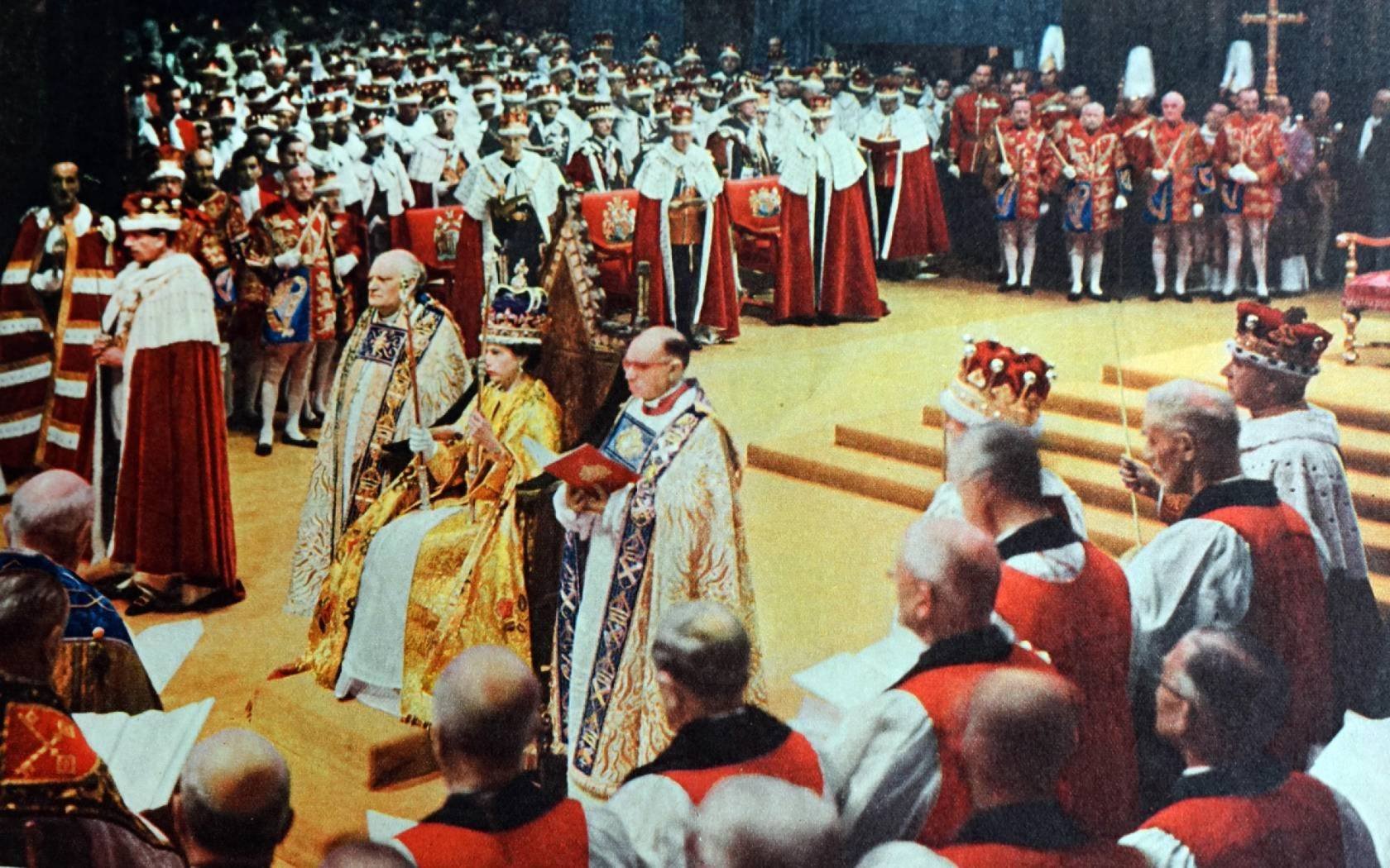 Queen Elizabeth II in her coronation robes, enthroned at Westminster Abbey, London after being crowned queen.