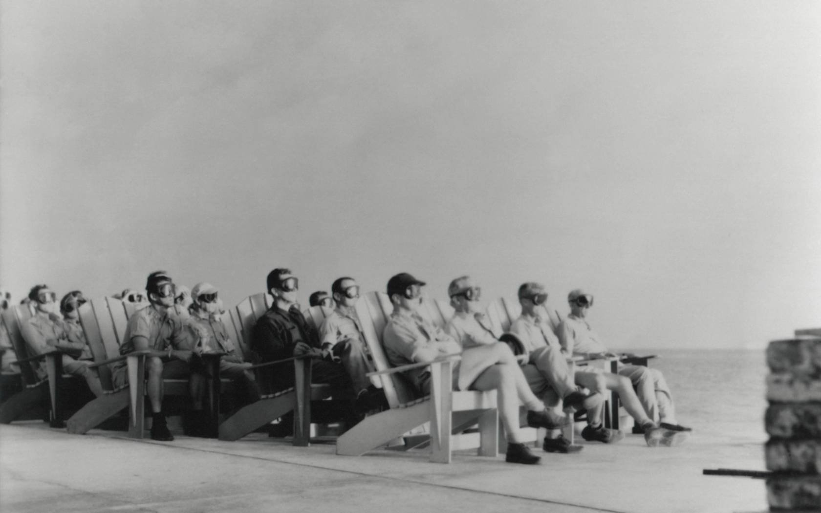 People in goggles watching the first test in a series, Operation Greenhouse, that tested principles leading to developing thermonuclear weapons (hydrogen bombs)