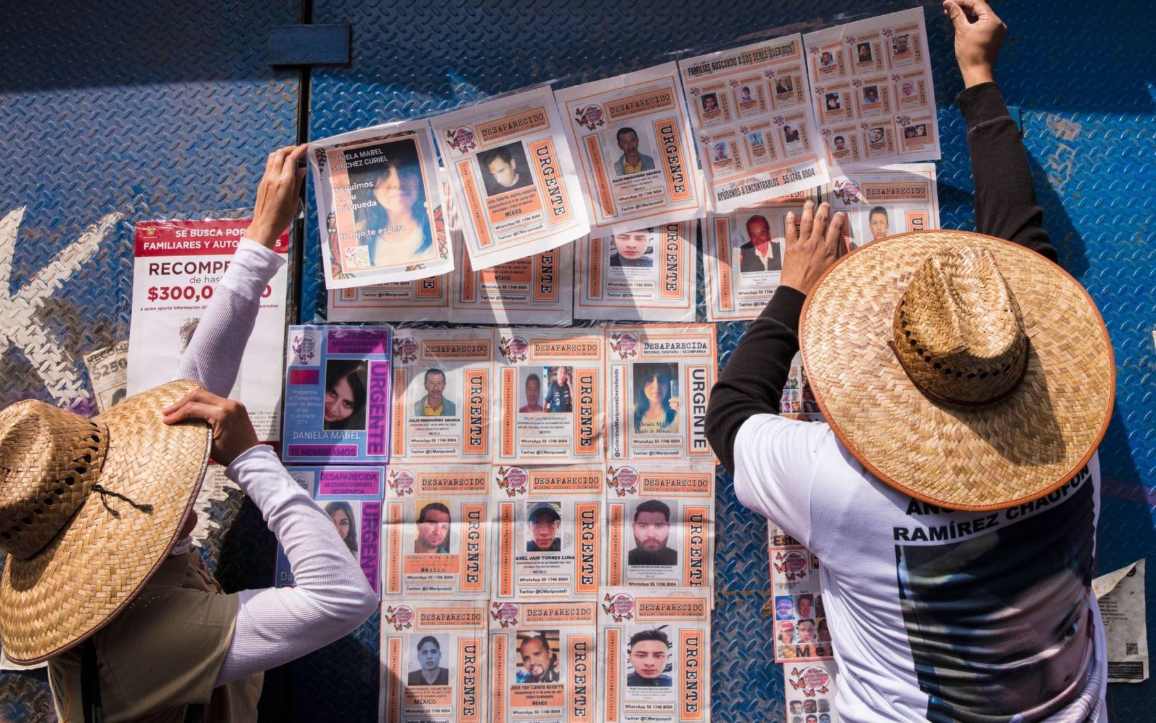 Relatives put up images of missing persons in Mexico City. Credit: Frank Nowikowski
