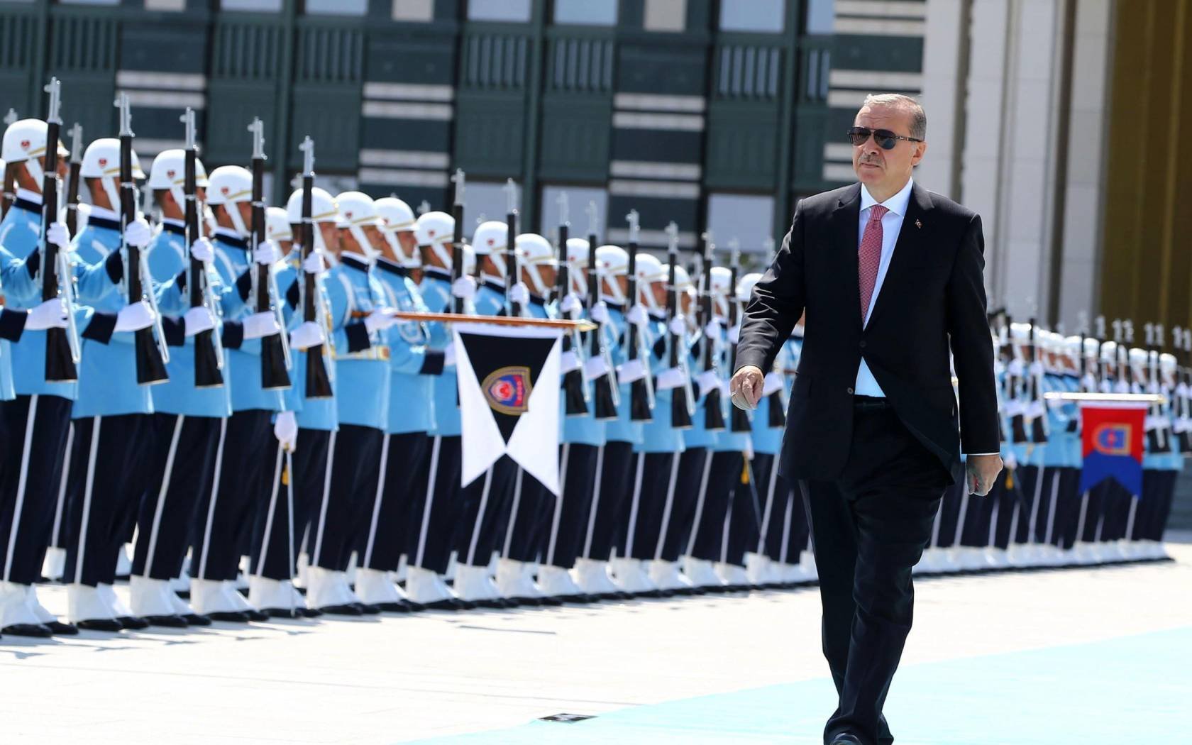 Turkey's President Recep Tayyip Erdoğan reviews the military guard of honour at the Presidential palace in Ankara. Credit: Associated Press.