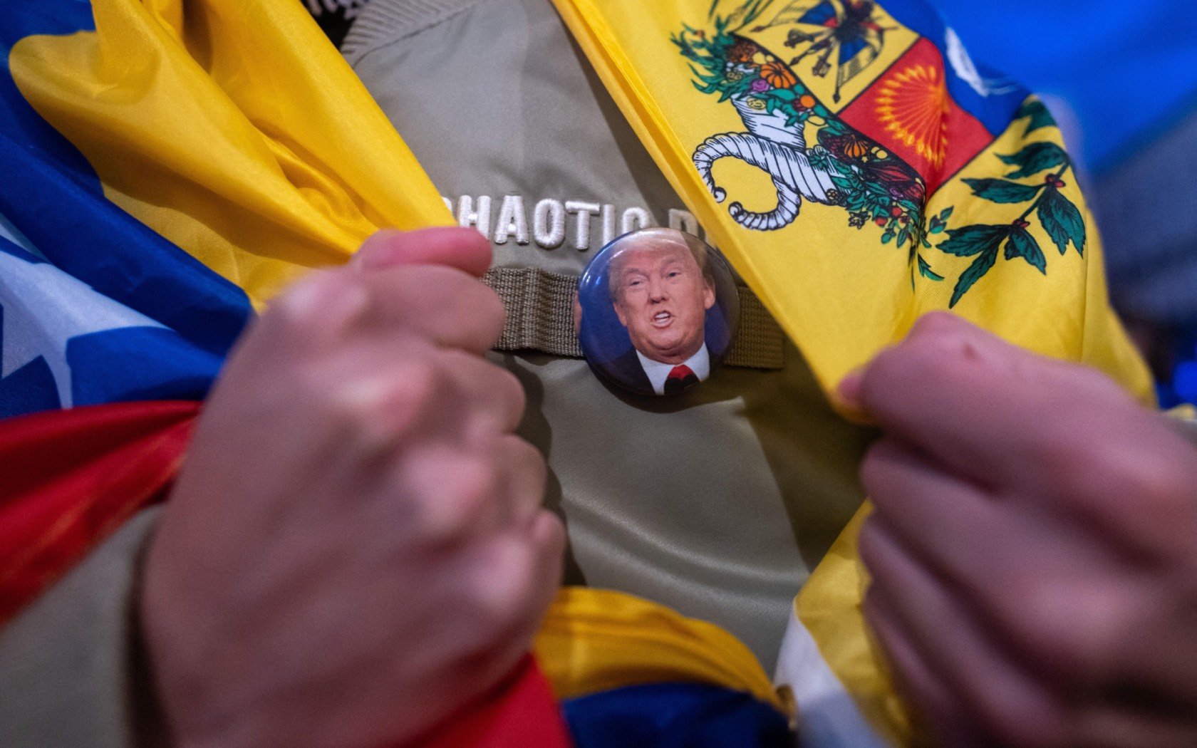 A Venezuelan living in Madrid celebrates the arrest of Nicolas Maduro at a gathering in Puerta del Sol. Credit: Marcos del Mazo