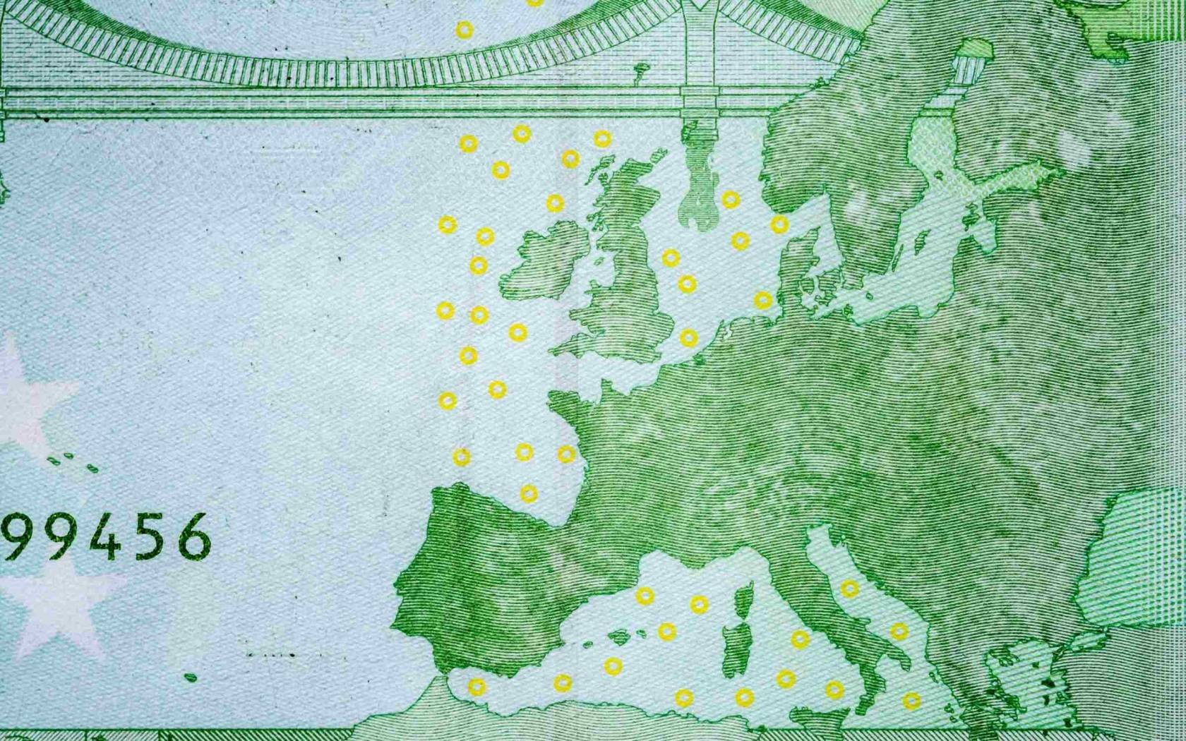 Close-up image of the map of Europe on a 100 euro banknote.