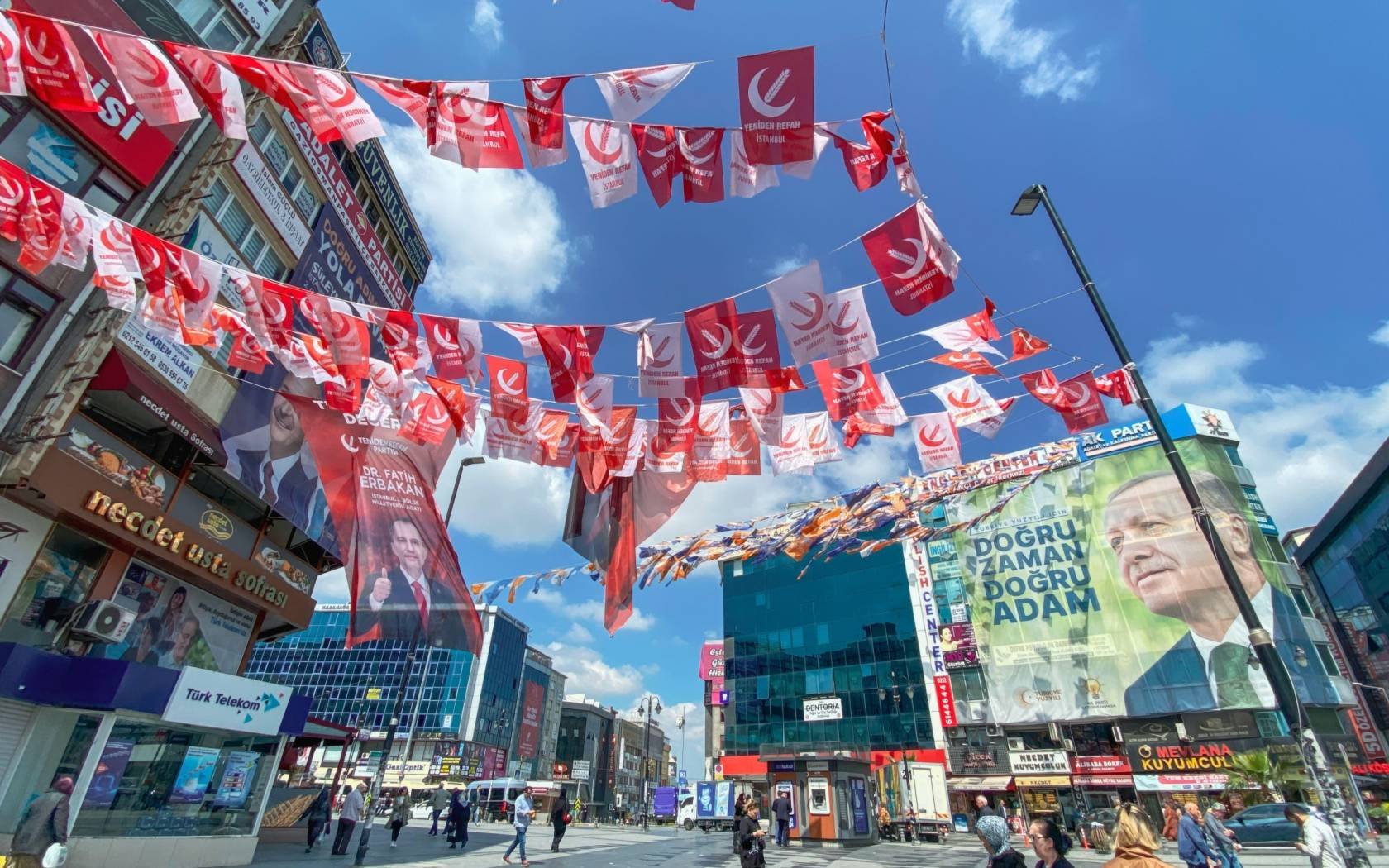 Flags of the New Welfare Party in front of a poster of Erdogan, Istanbul, Turkey.