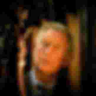 King Charles III views a wooden carving at St. Laurence's Church in Ludlow, Shropshire.