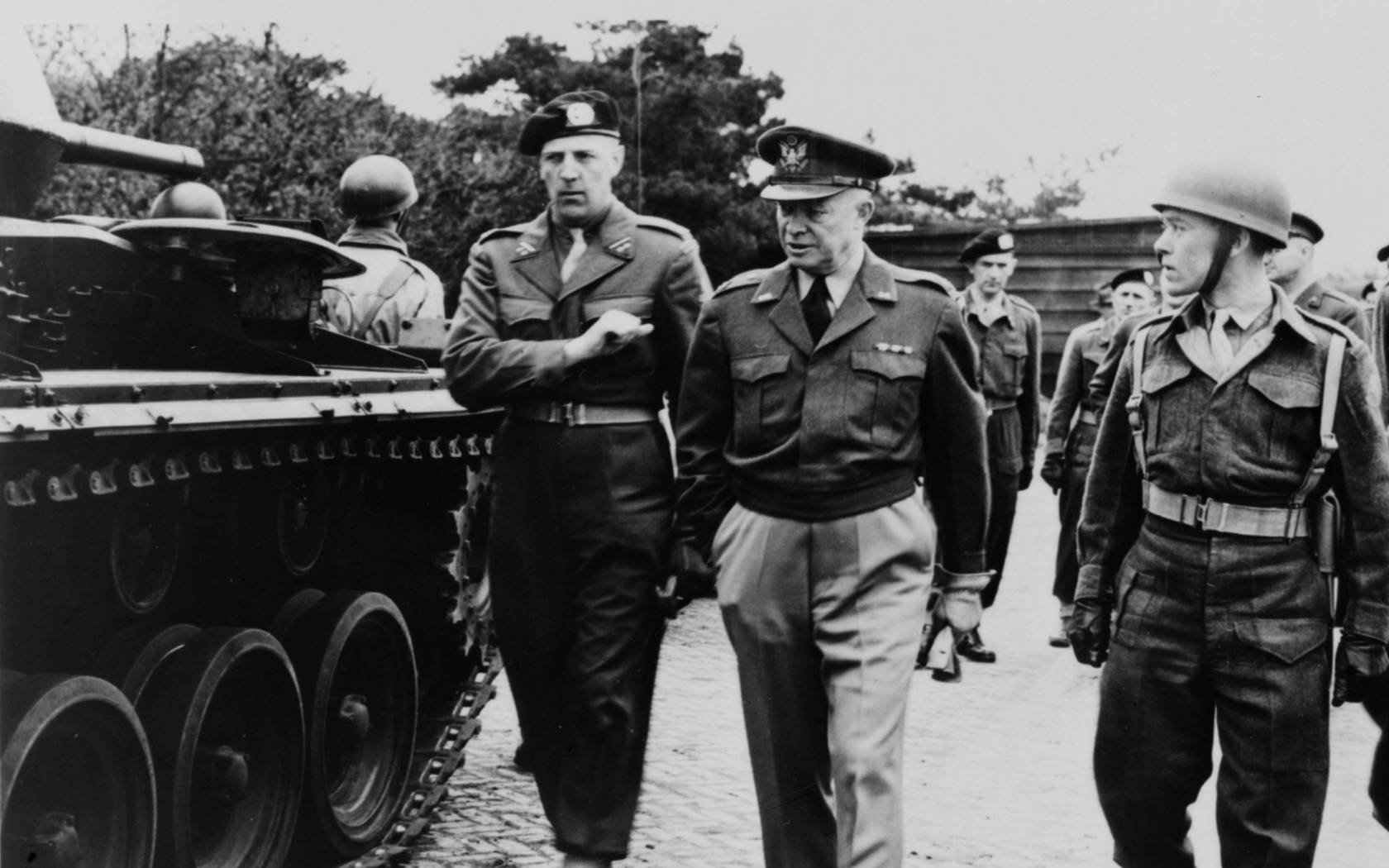 US General Dwight Eisenhower (1890-1969) inspecting troops.
