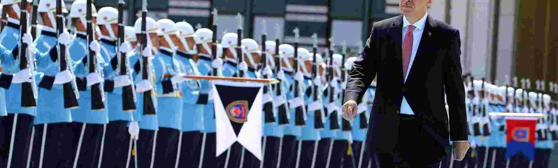 Turkey's President Recep Tayyip Erdoğan reviews the military guard of honour at the Presidential palace in Ankara. Credit: Associated Press.
