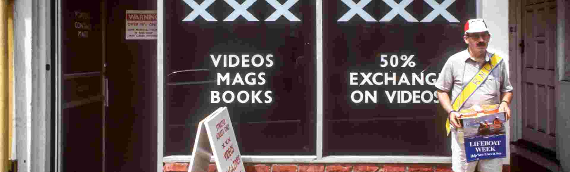 A man raising money for charity outside a sex shop in Brighton, East Sussex.