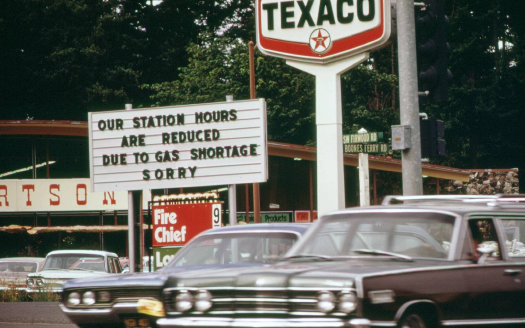 Cars driving past a Texaco station in 1970s Portland, Oregon.