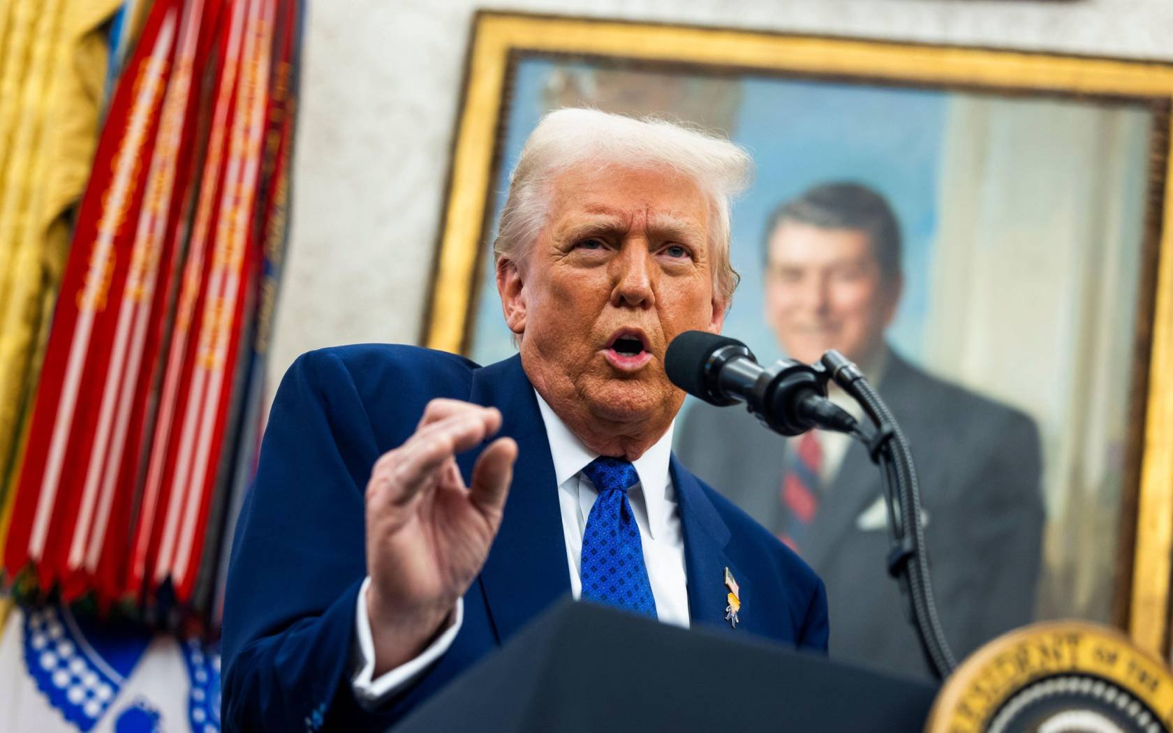 US President Donald Trump speaks in the Oval Office of the White House.