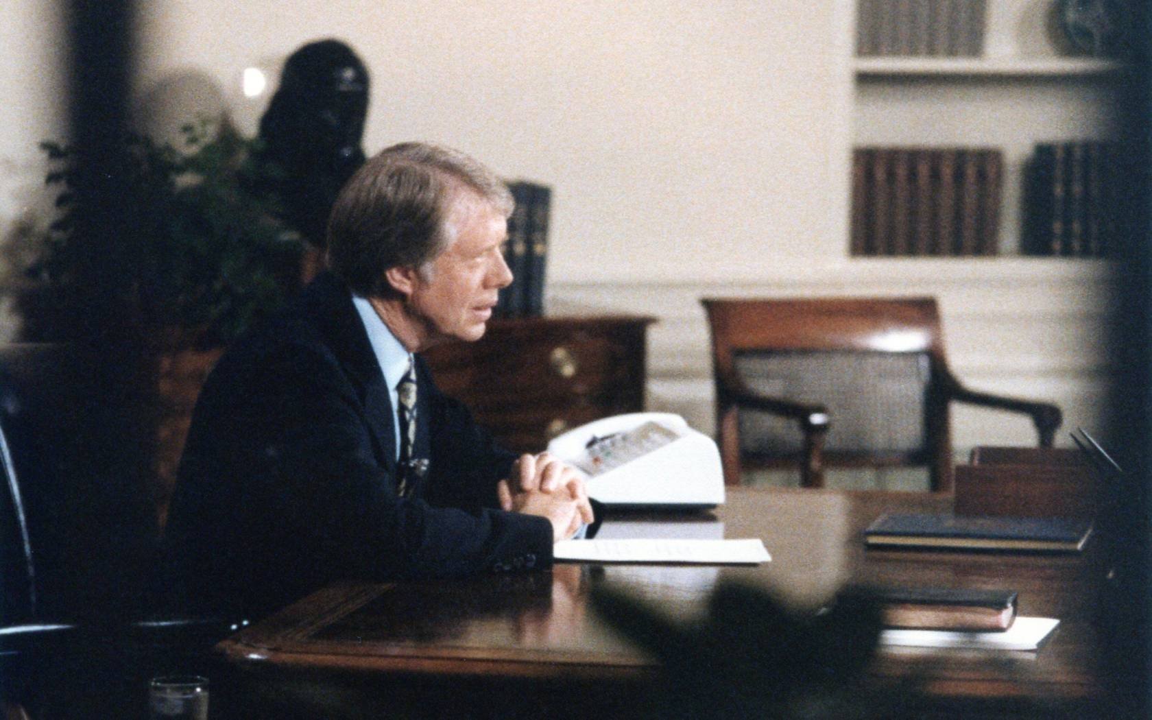 Jimmy Carter through the window of the Oval Office.