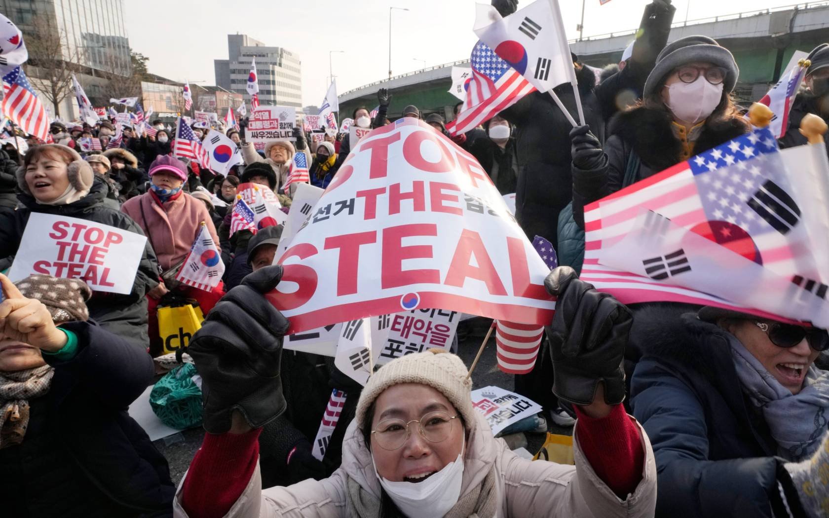 Supporters of impeached South Korean President Yoon Suk-yeol shout slogans during a rally to oppose his impeachment near the presidential residence in Seoul.