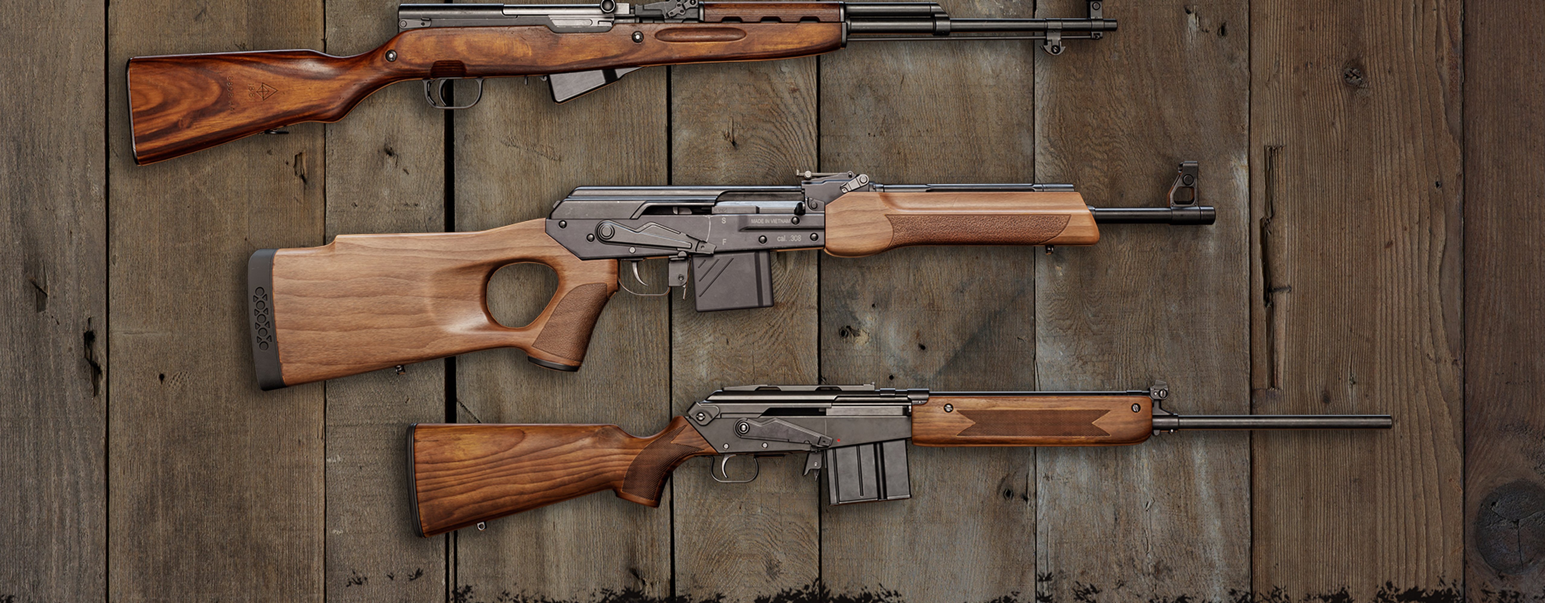 Three new weapons from the Rapid Hunt Rifle Pack showcased on a wooden wall