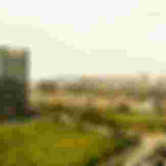 High-rise buildings replace old residences in Zhejiang, China. Credit: Charles O. Cecil / Alamy Stock Photo