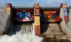 Colourful paintings on dam, Stora Sjofallet hydro electric power station, Lapland, Norrbotten, Sweden, June 2013.