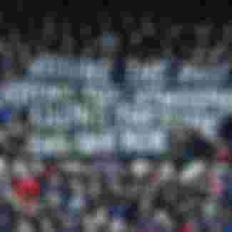 Crystal Palace Fans hold up a banner to protest against VAR.