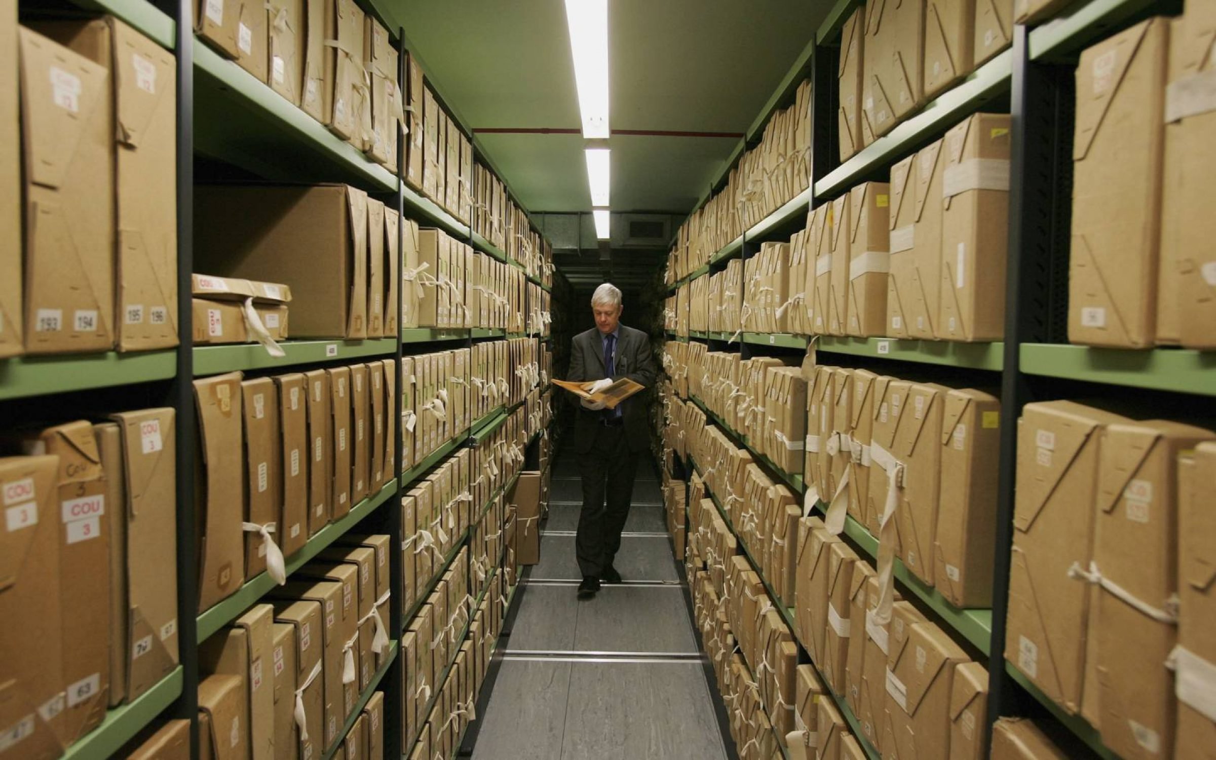 A member of staff removes a file from a depository at The National Archives, London. Credit: Scott Barbour/Getty Images