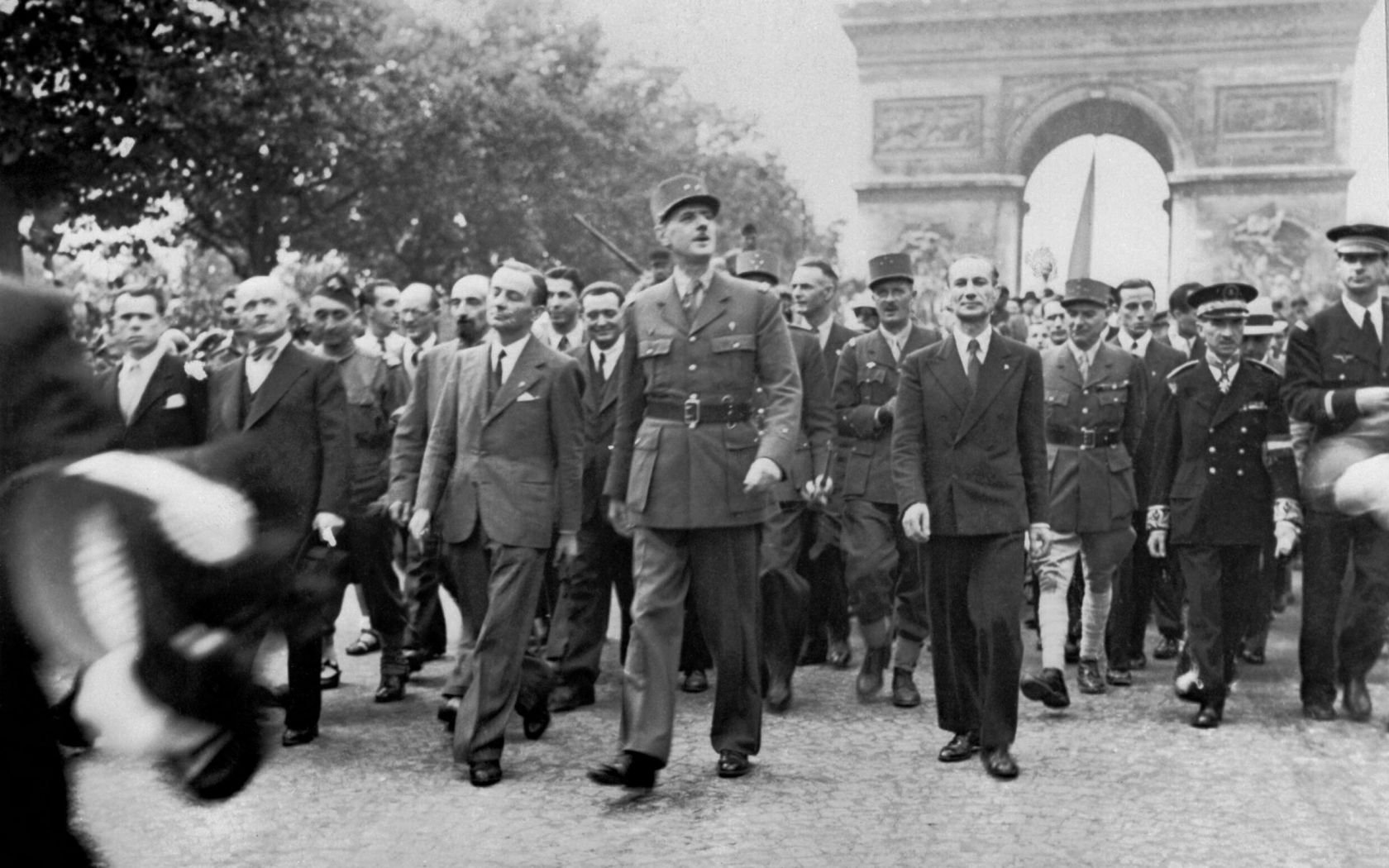 PARIS, FRANCE - 25 August 1944 - The Liberation of Paris, 25 - 26 August 1944. General Charles de Gaulle and his entourage set off from the Arc de Tri