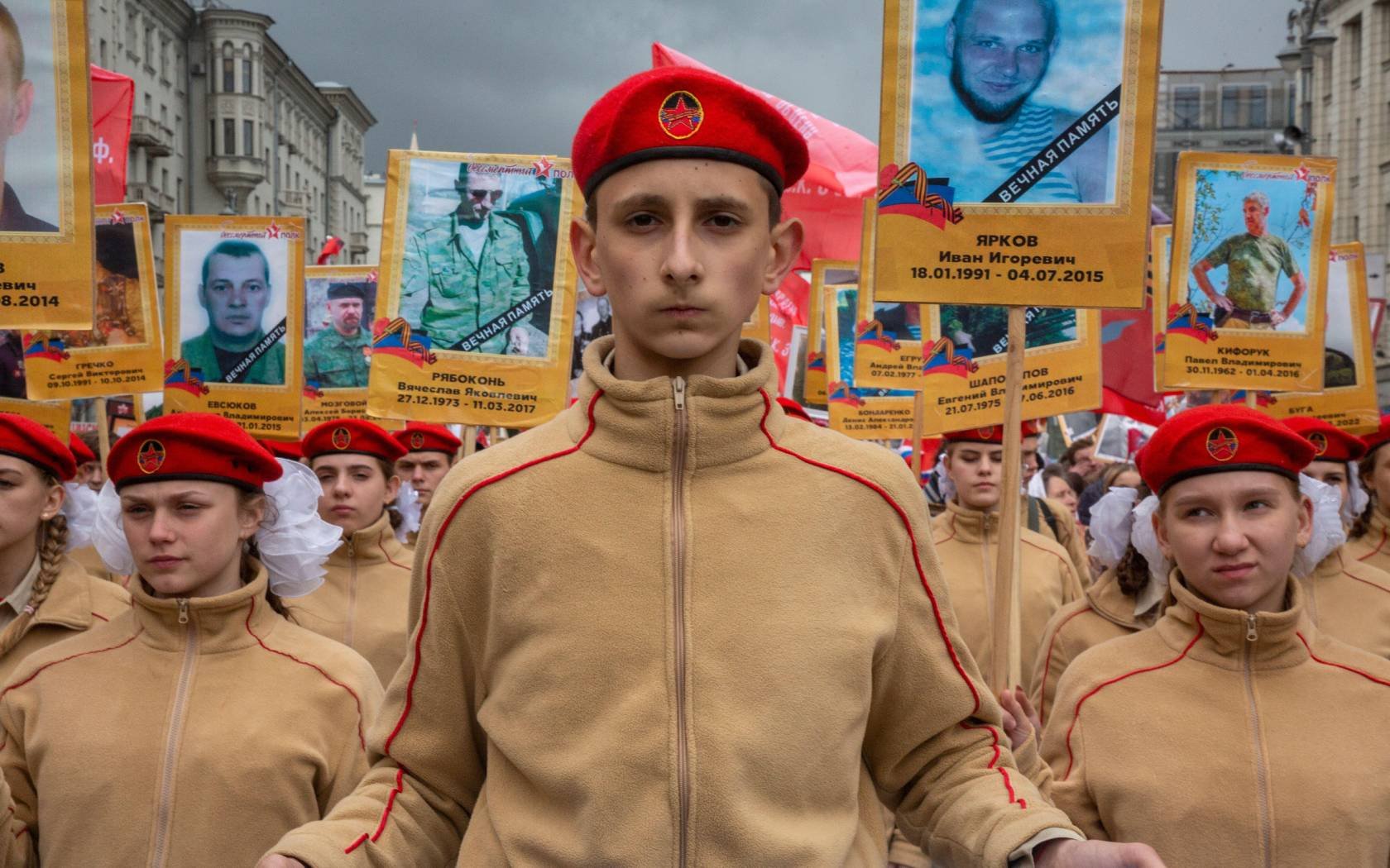 Young people hold portraits of people who died in Ukraine between 2014 and 2022, during the Immortal Regiment march marking the 77th anniversary of the end of the Second World War on Tverskaya street in central Moscow, Russia.