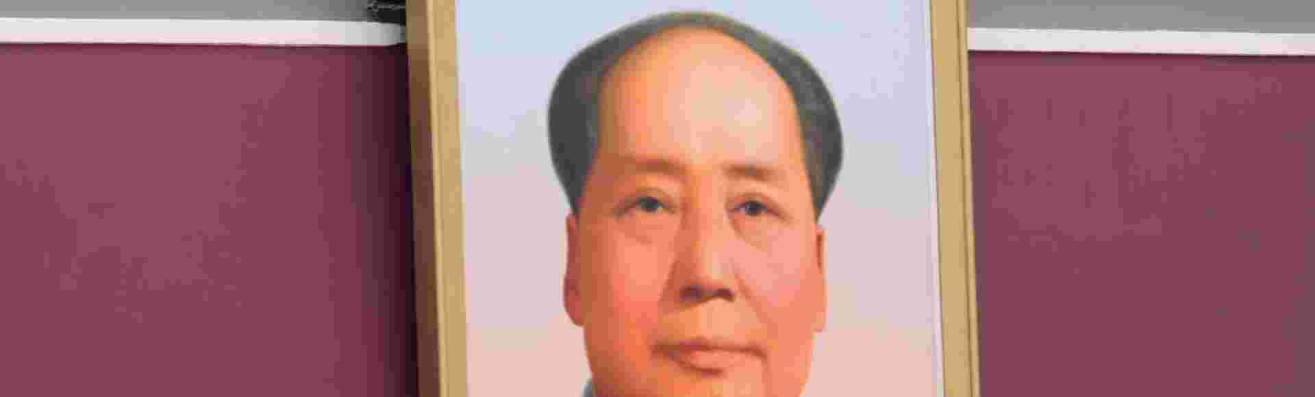 Xi Jinping waves above a large portrait of the late leader Mao Zedong during a ceremony to mark the 100th anniversary of the founding of the ruling Chinese Communist Party.