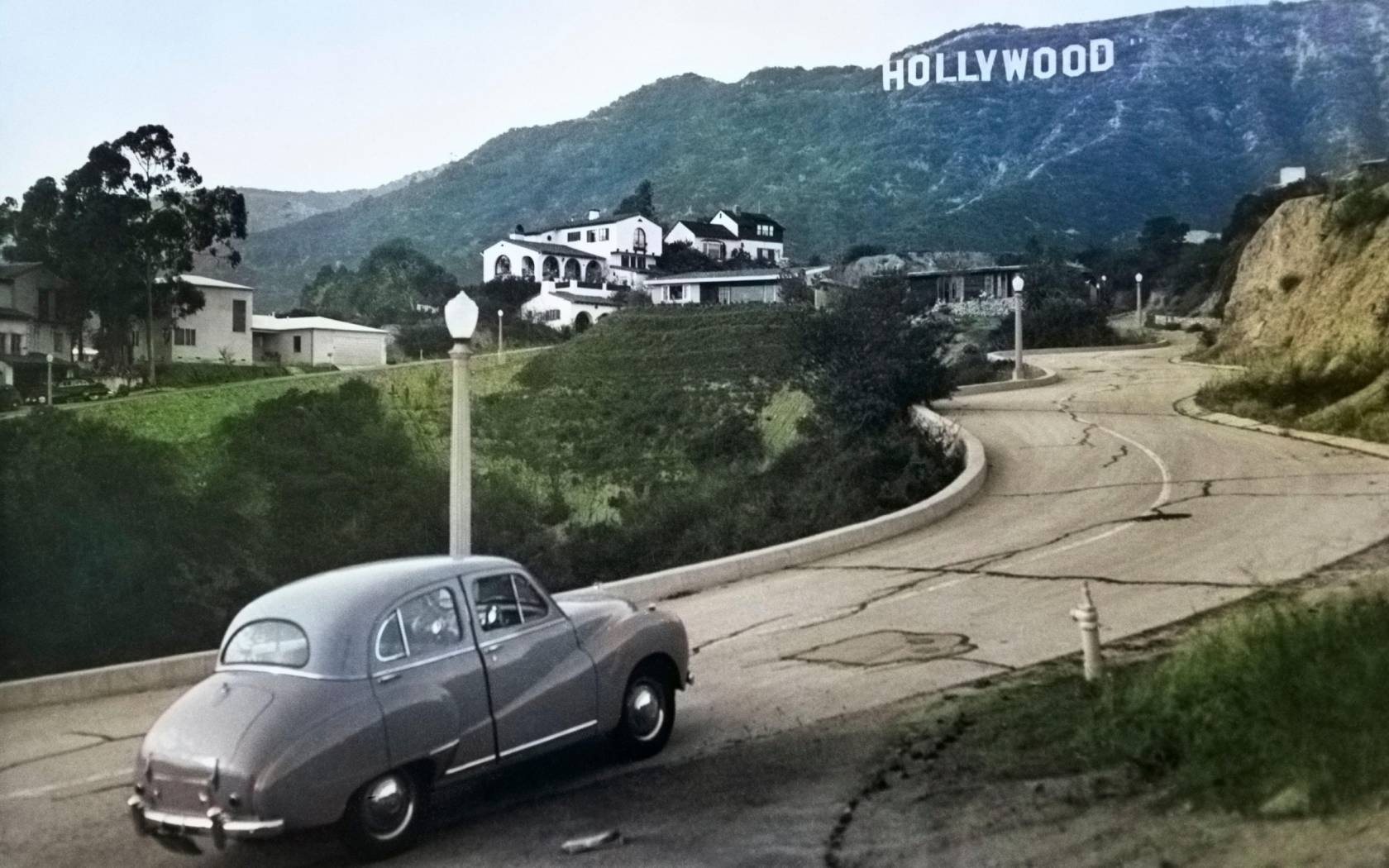 1950s Austin driving towards the Hollywood hills.