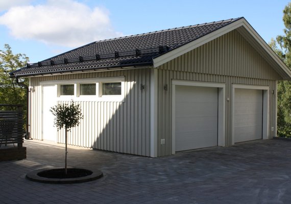 Large custom sun blasted double garage door solution