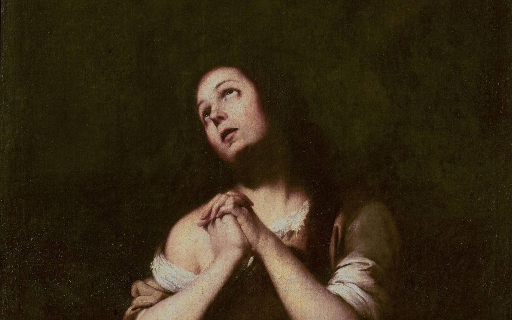 Painting of a woman in prayer.