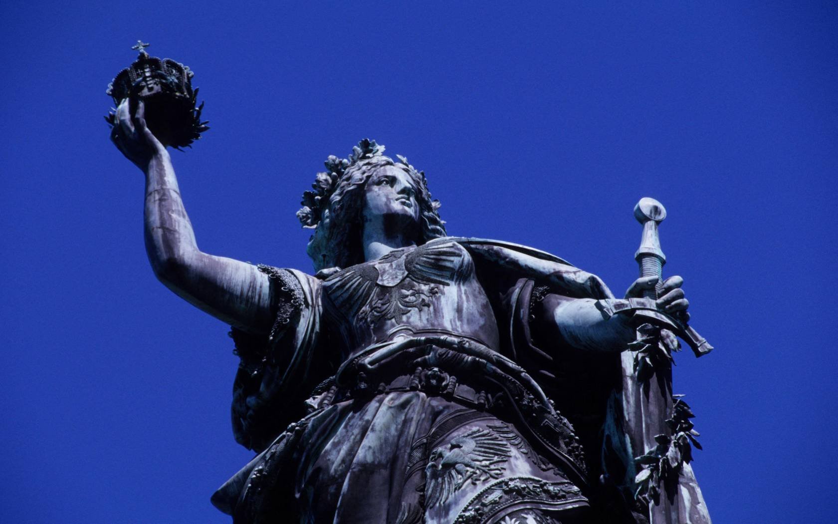 A statue of an angel holding an imperial crown aloft in Germany's Niederwald Monument.