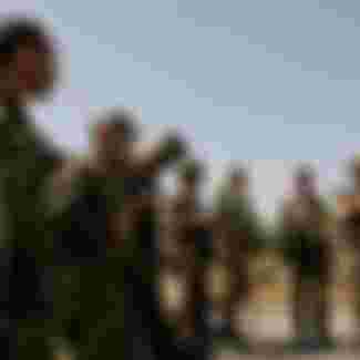 Russian soldiers receive instructions from their commander before entering the city Gori, during the Russo-Georgian War August 2008. Credit: Eddie Gerald / Alamy Stock Photo.