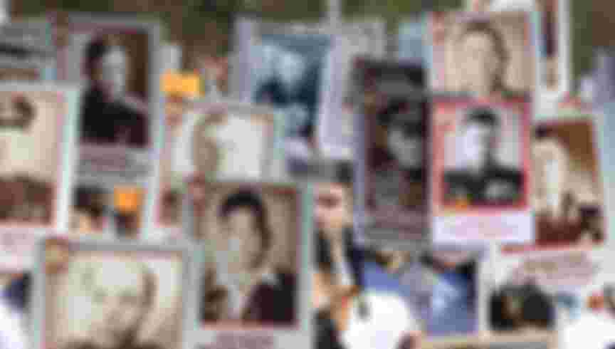 People carry portraits of their relatives - soldiers of the Second World War - as they take part in the Immortal Regiment march in downtown Moscow. Credit: Aleksey Fokin/SOPA Images/LightRocket via Getty Images