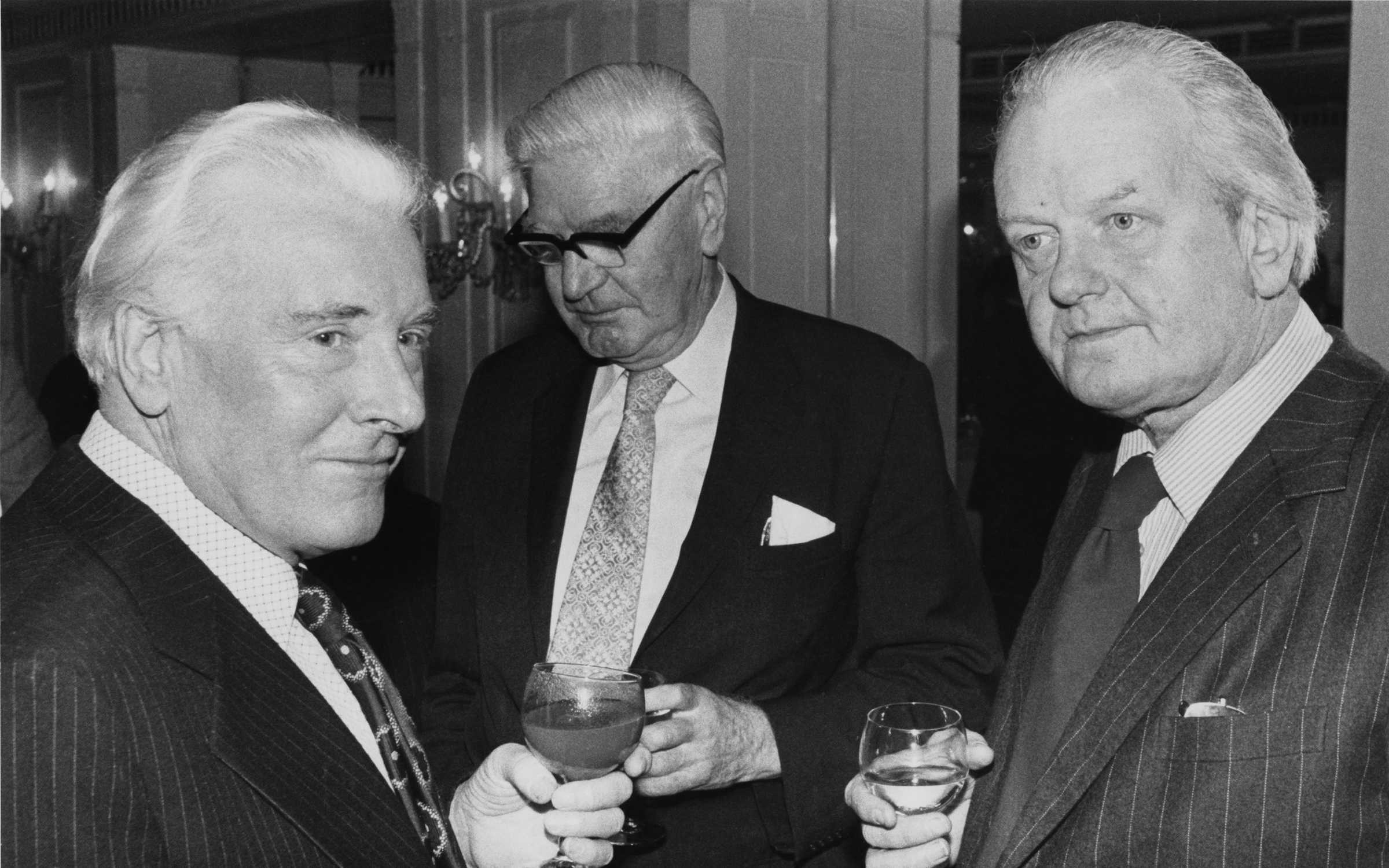 George Kennedy Young (middle) stands between fellow espionage writers Andrew Boyle (left) and Major Douglas Sutherland (right)