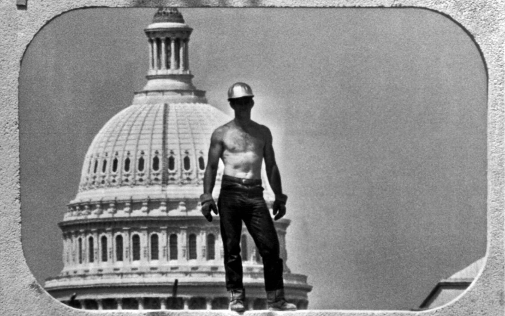 A construction worker in Washington, 1962, framed by the Capitol Building