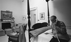 Lady Bird and Lyndon Johnson taking phone calls in their White House bedroom after he announced his withdrawal from the 1968 election.