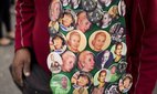 A man sells pins of Argentine leaders such as former President Juan Domingo Peron and his wife Eva during a May Day march in Buenos Aires, Argentina.