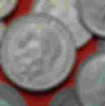 German statesman Konrad Adenauer depicted on a coin.