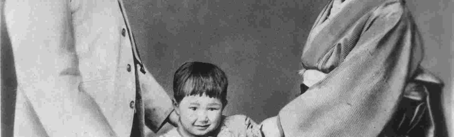 Lafcadio Hearn photographed with his wife, Setsuko Koizumi, and their son.