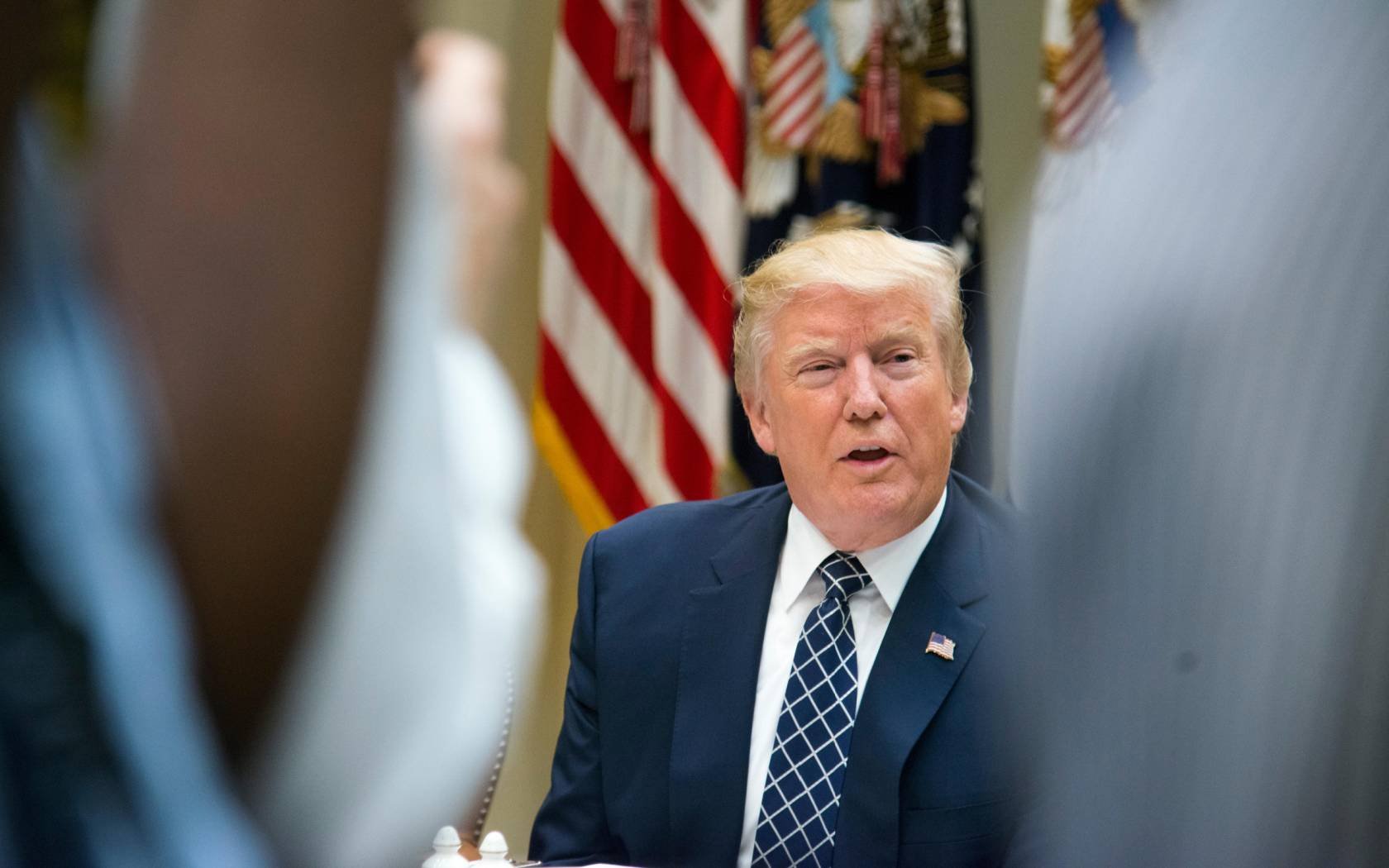 President Donald J. Trump in 2017 at a lunch with then National Security Advisor, H.R. McMaster.
