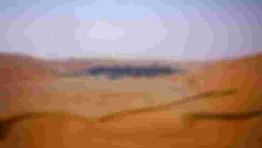 Saudi Aramco's Shayba oilfields in the desert dunes of Saudi Arabia. Credit: Simon Dawson / Bloomberg via Getty Images.