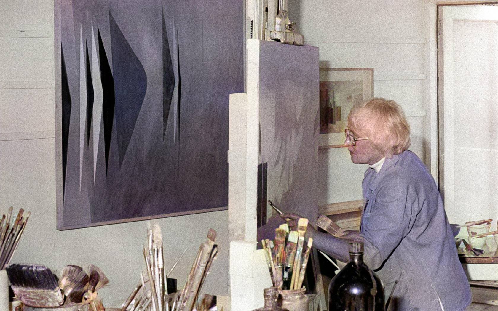 Wilhelmina Barns-Graham (1912-2004), one of the St Ives School of artists and founder member of the Penwith Arts Society, seen here at work in her studio in St Ives, Cornwall.