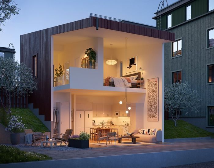 En hyresrätt i ett eget hus med många fönster och en balkong. Hebas studiohus i Smedjan i Källberga.