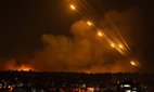 Rockets are fired toward Israel from the Gaza Strip, Sunday 8 October 2023.